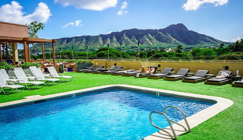 image of an outdoor pool with synlawn turf surrounding it