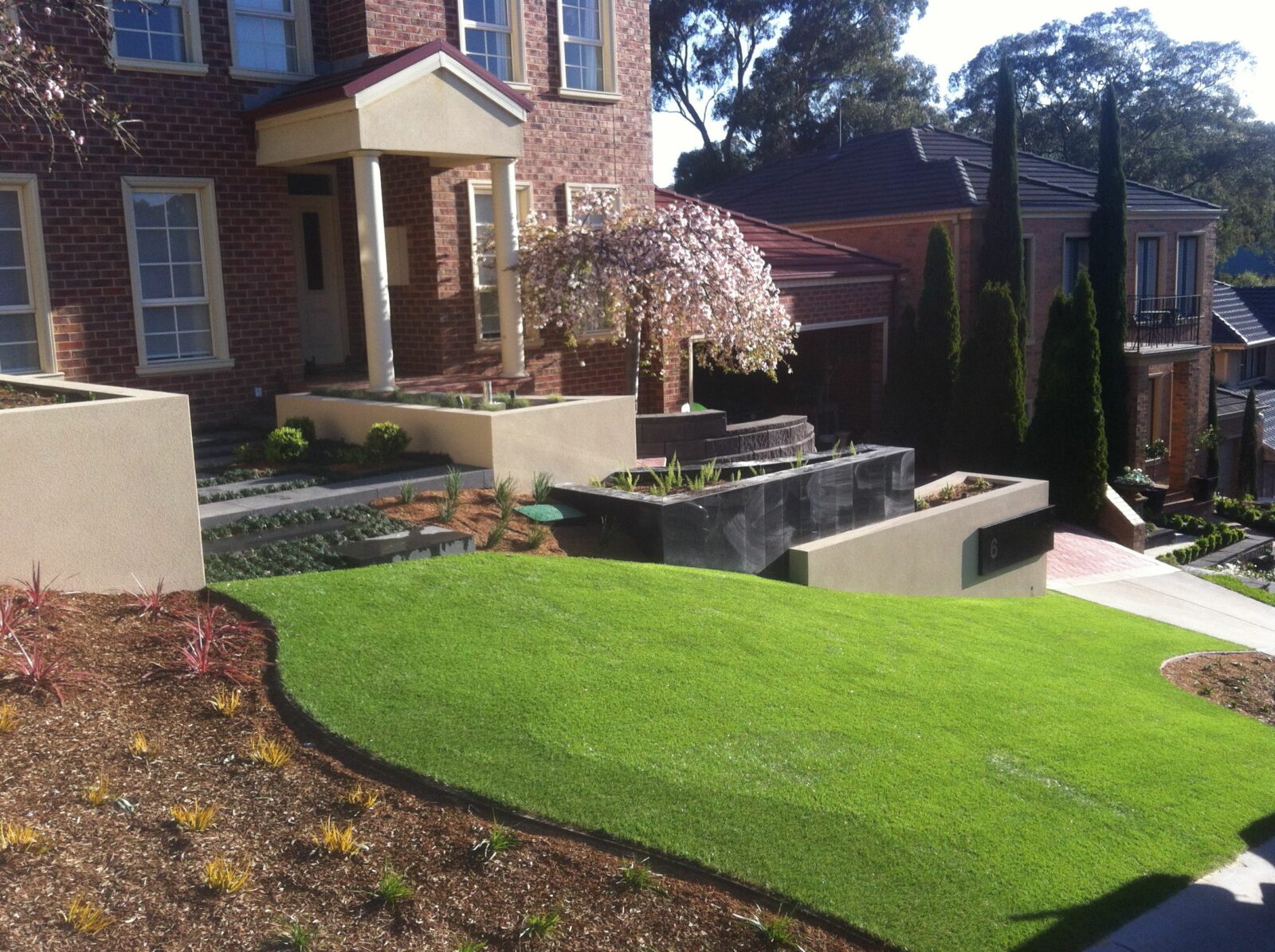 Can artificial grass be laid on any surface?